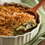 Green Bean Casserole Topped with Crispy Fried Onions in a Baking Dish