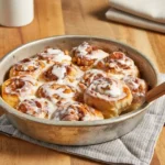 Easy cinnamon rolls — golden rolls with brown sugar walnut filling and light glaze.