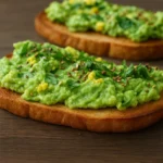 Meyer lemon avocado toast on whole grain bread topped with cilantro and chia seeds.