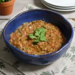 Bowl of homemade smoky four-pepper salsa made with roasted tomatoes and mixed peppers